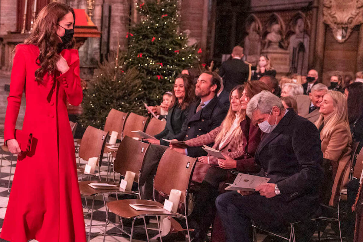 Kate Middleton, whose mother, Carole Middleton, has body language around compared to her other children, walks by her family