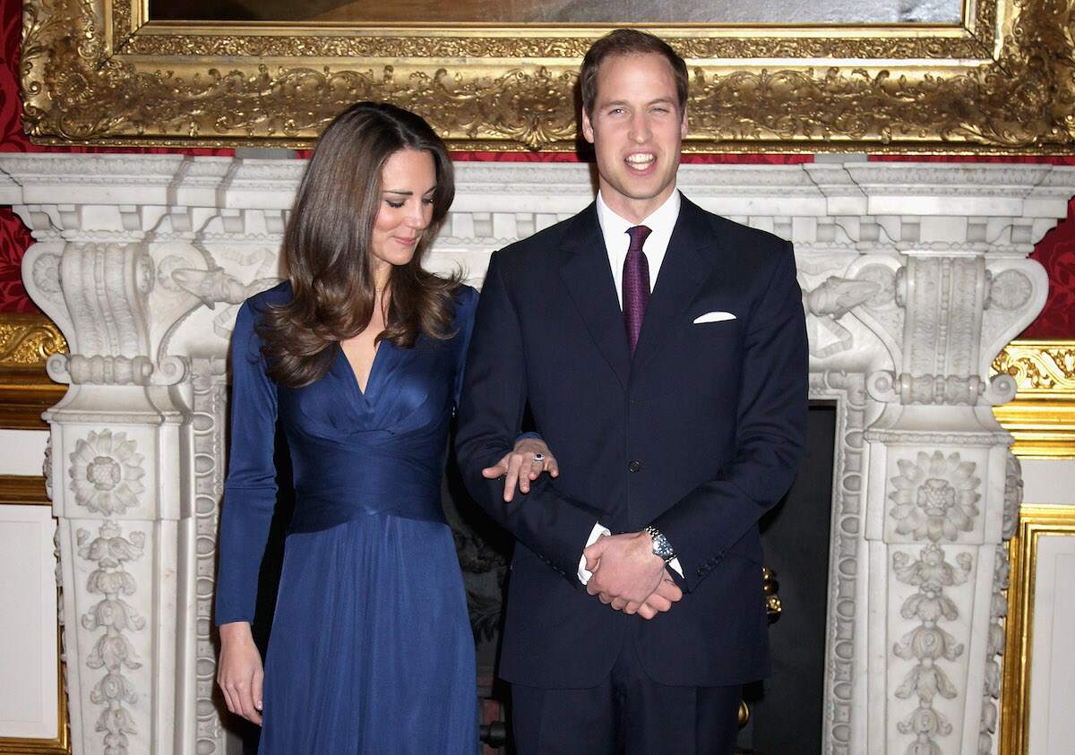 Prince William and Kate Middleton pose for photographs after getting engaged in 2010