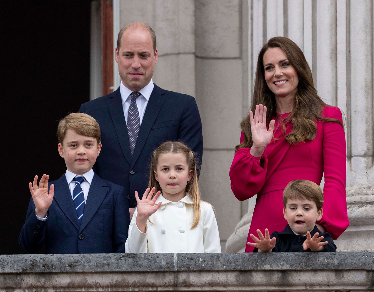 Prince William and Kate Middleton standing with Prince George, Prince Louis, and Princess Charlotte on the balcony of Buckingham Palace at the end of the Platinum Pageant