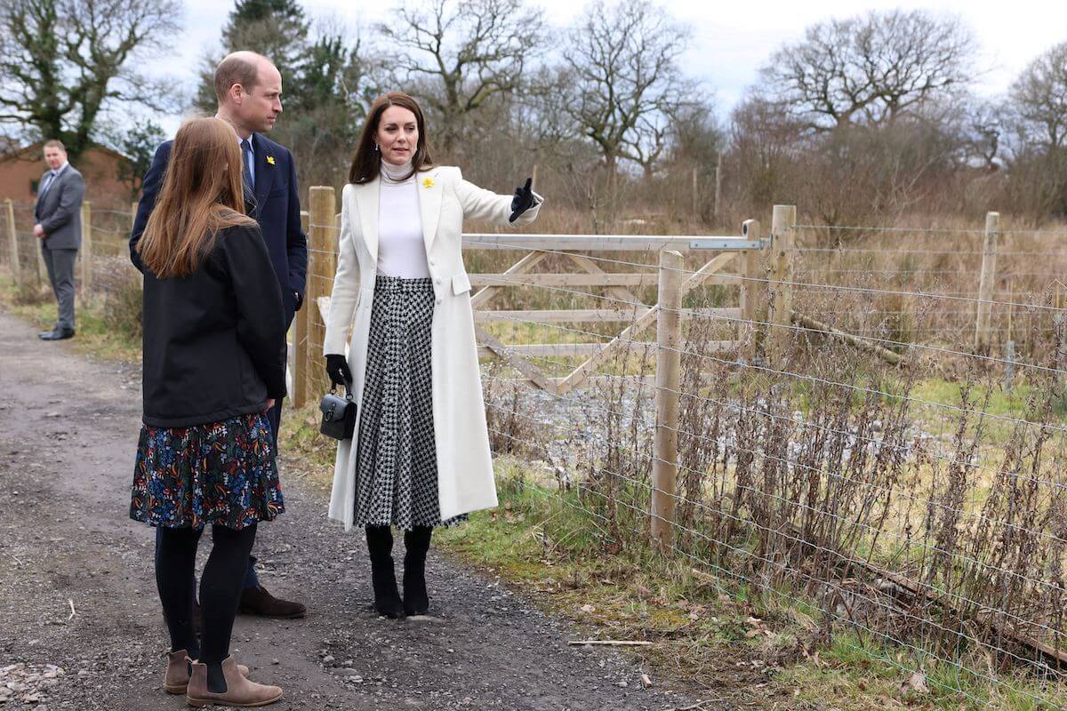 Kate Middleton wears a Zara skirt as she stands with Prince William