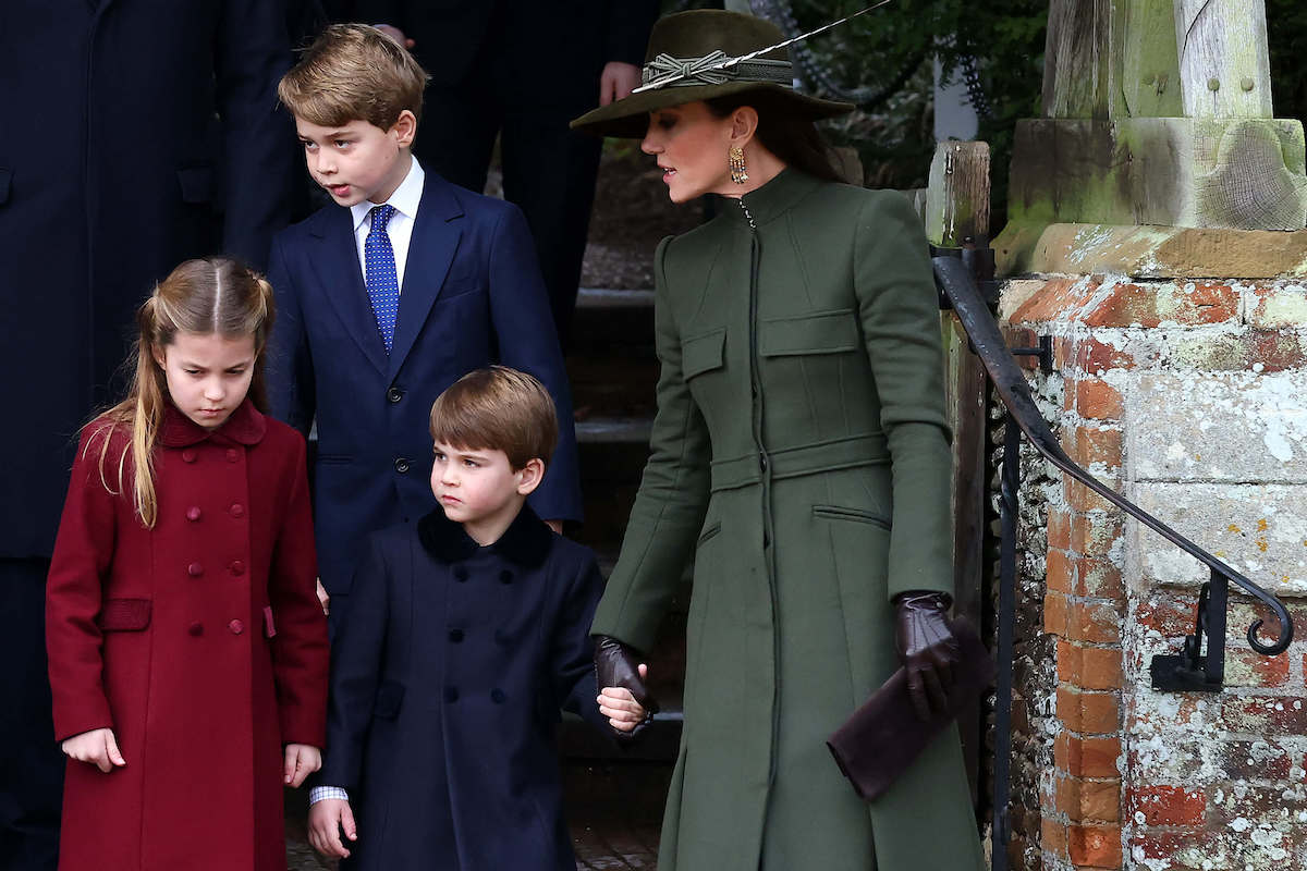 Kate Middleton, who reportedly has a 'secret code' to get Princess Charlotte, Prince George, and Prince Louis to stop misbehaving, walks with her children