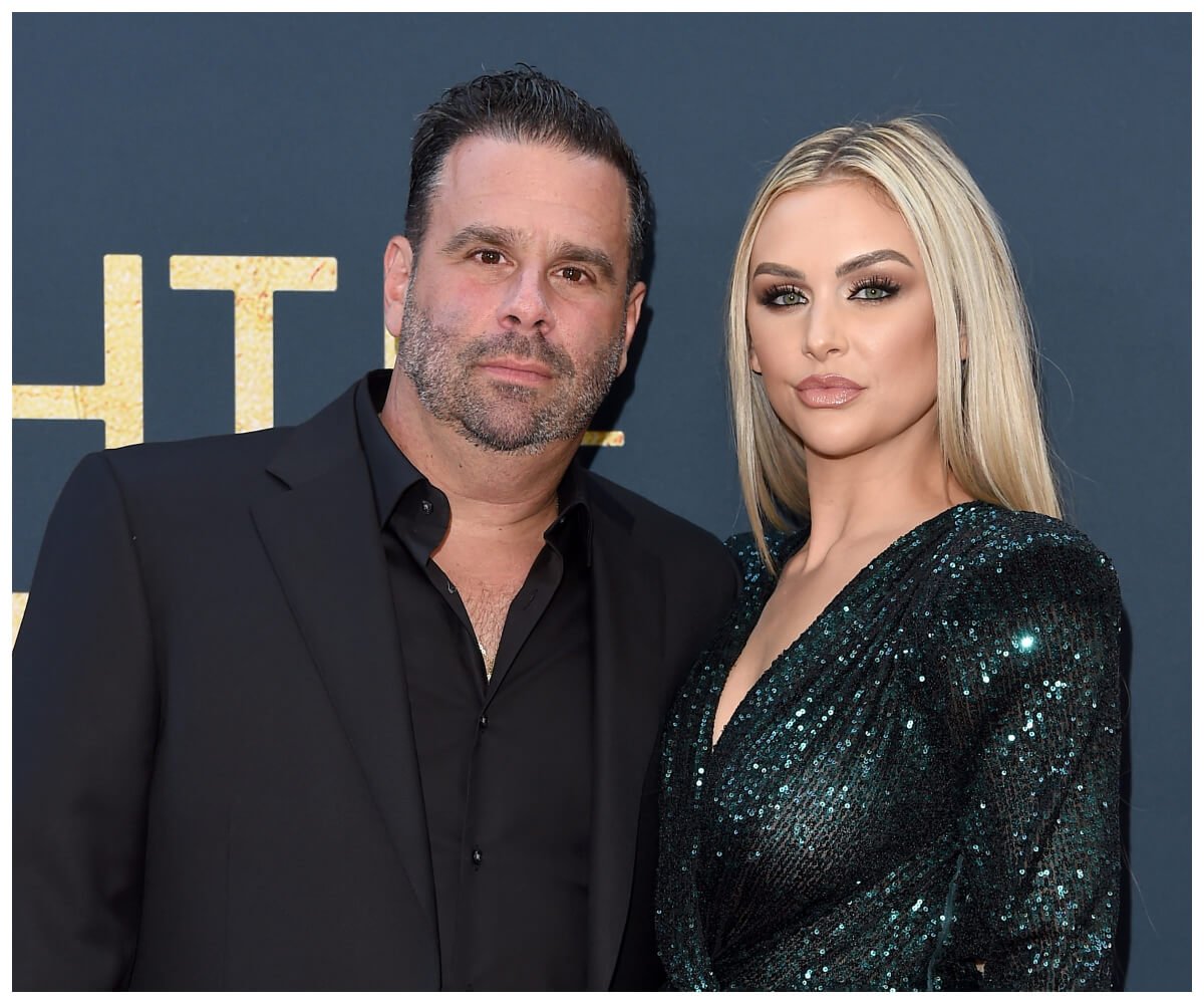 Randall Emmett and Lala Kent pose together at an event.