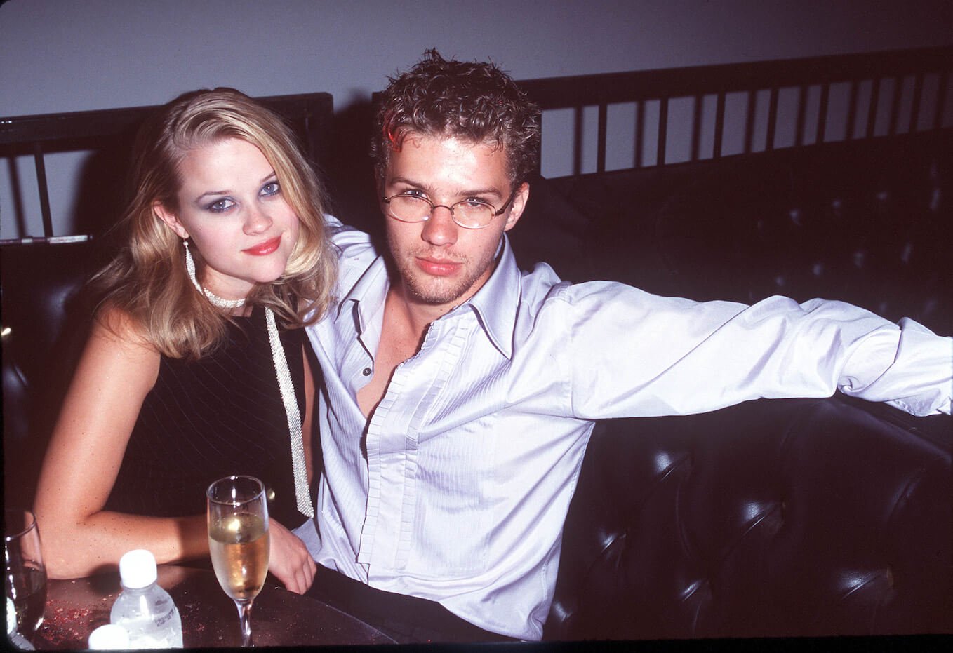 Reese Witherspoon and Ryan Phillippe lying on a couch together