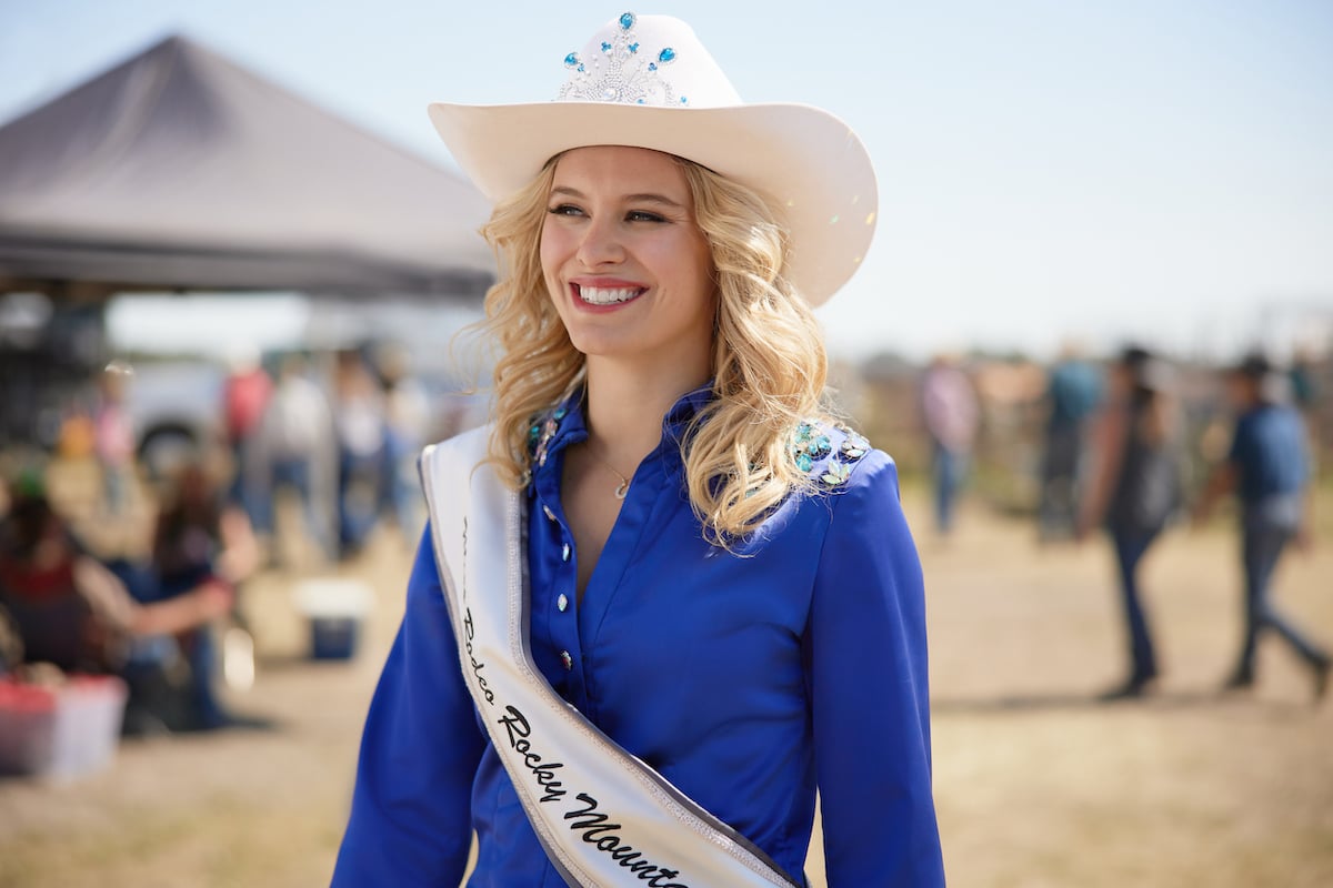Hallmark Channel 'Ride' cast member Tiera Skovbye wearing a white cowboy hat and blue shirt