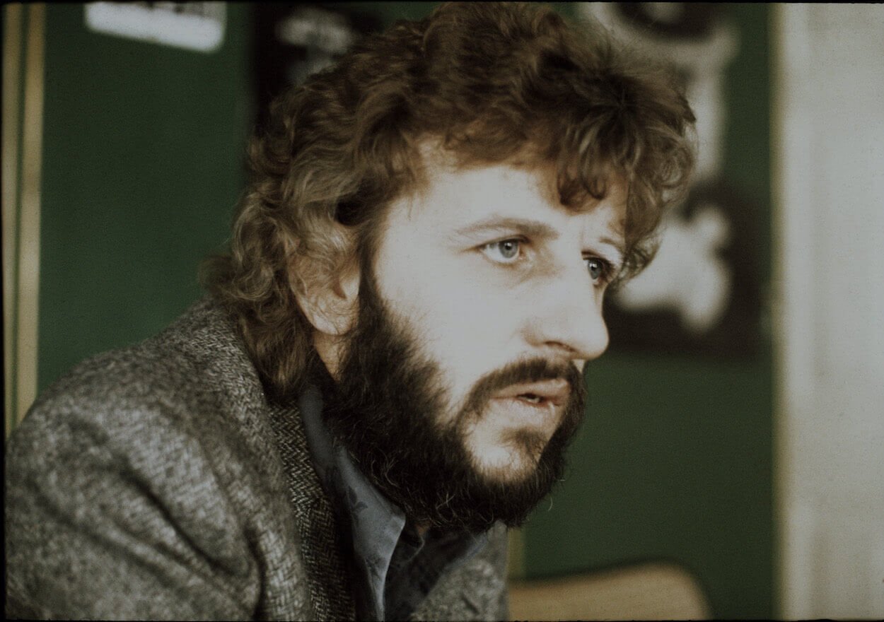 Former Beatles drummer Ringo Starr sports a beard and wears in 1973.