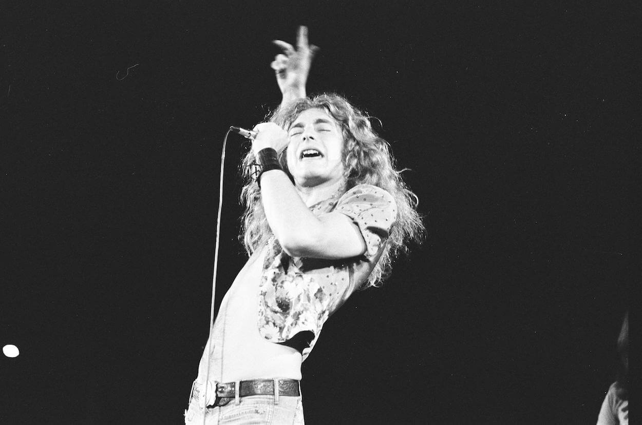 Led Zeppelin's Robert Plant extends his right hand into the air as he sings during a 1972 concert in Japan.