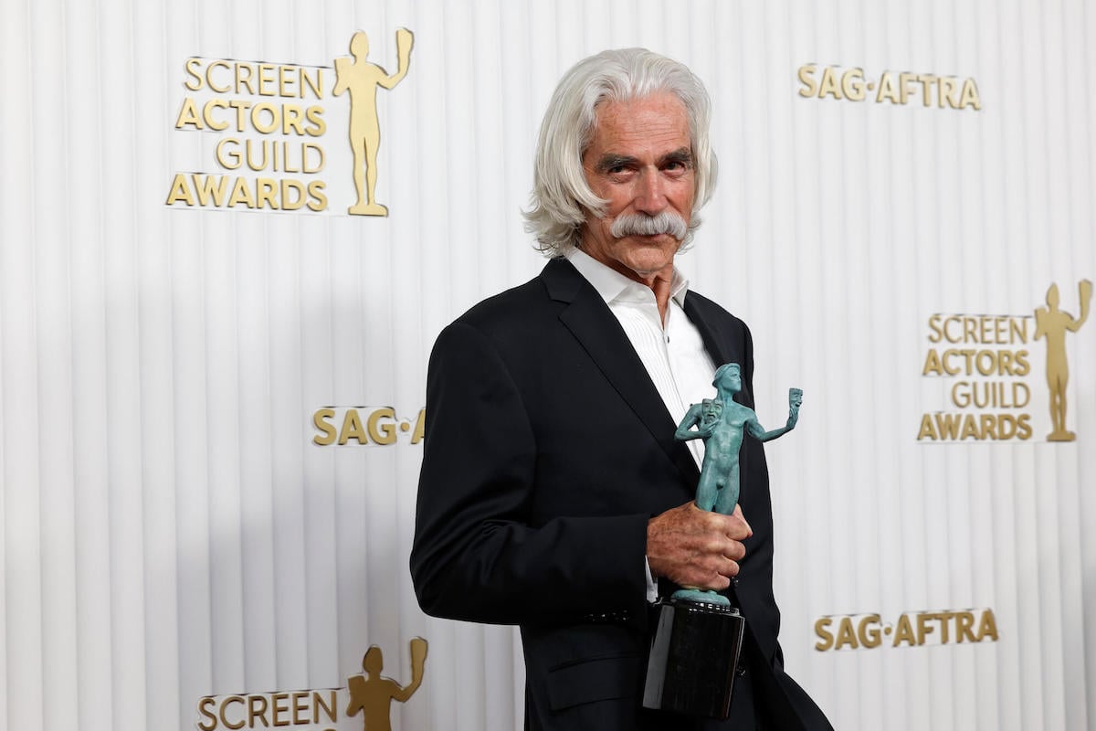 Sam Elliott smiling, holding a Screen Actors Guild Award