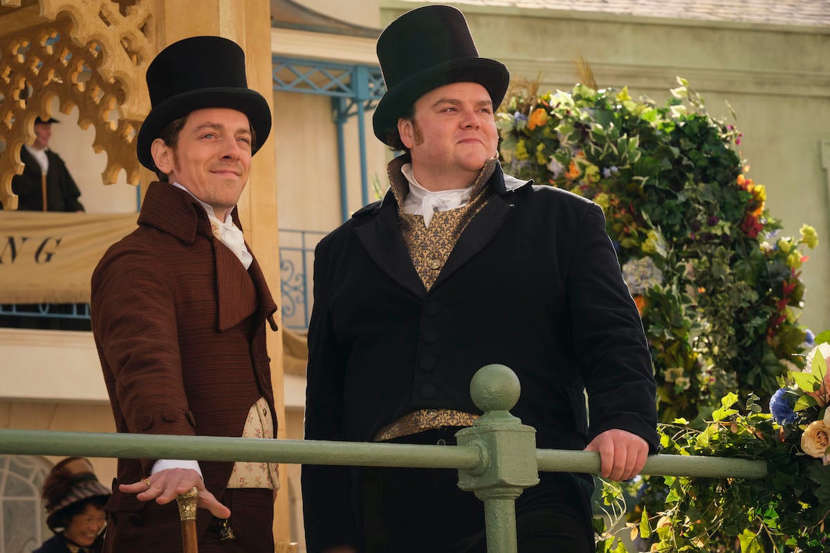 Edward Davis as Montrose and Turlough Convery as Arthur Parker, standing on a balcony in 'Sanditon' Season 3