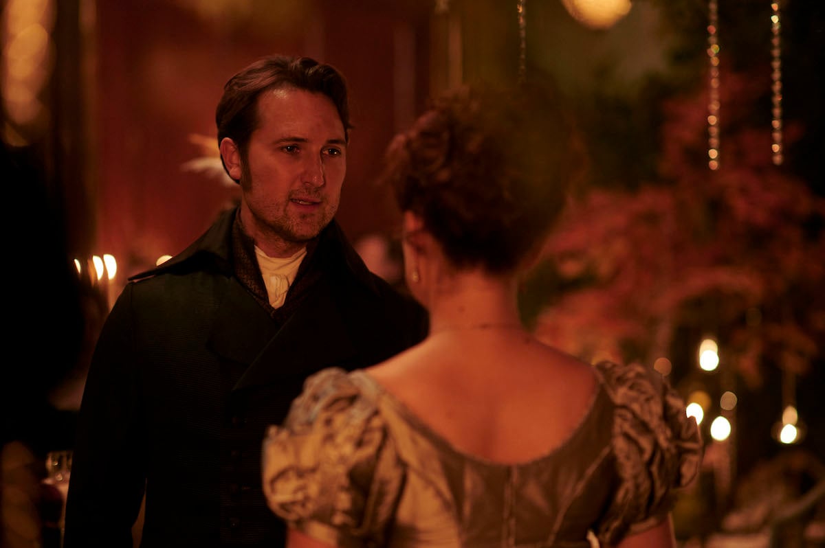 Ben Lloyd-Hughes as Alexander Colbourne looking at Rose Williams as Charlotte in 'Sanditon' Season 3