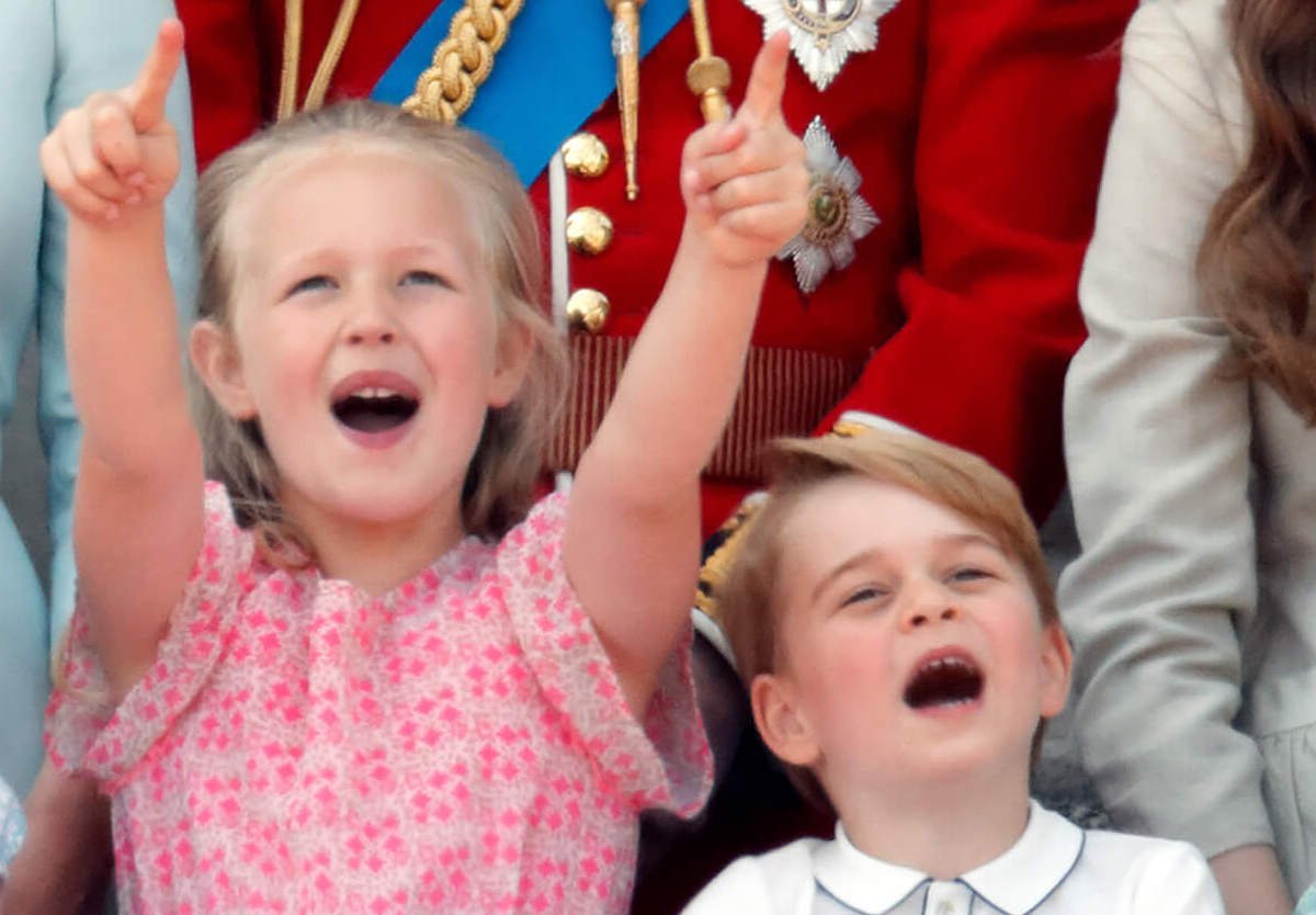 Prince George, whom a body language expert looks up to his cousin, Savannah Phillips, stands next to Savannah Phillips