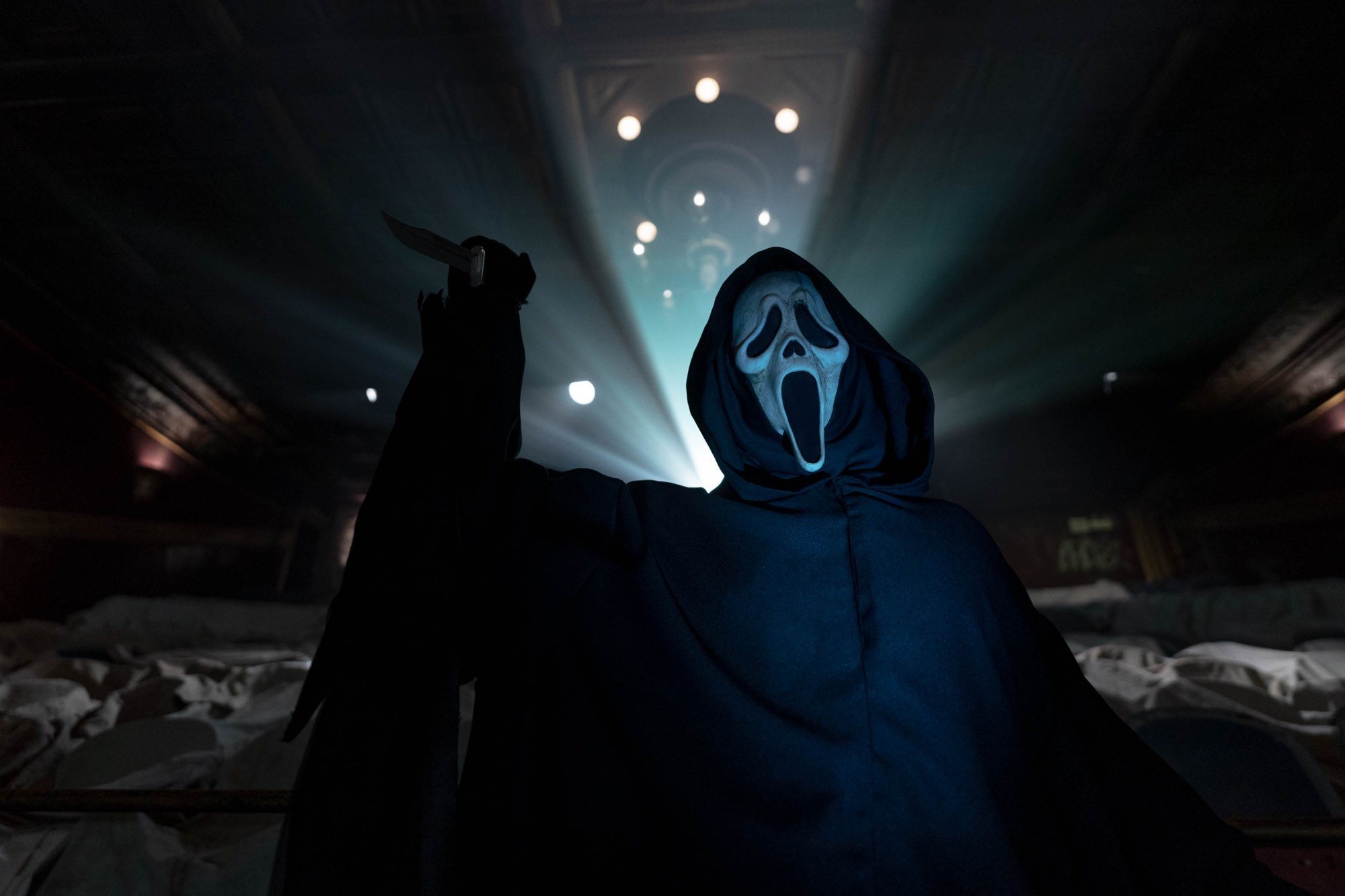 'Scream VI' Ghostface in a space with lights behind him