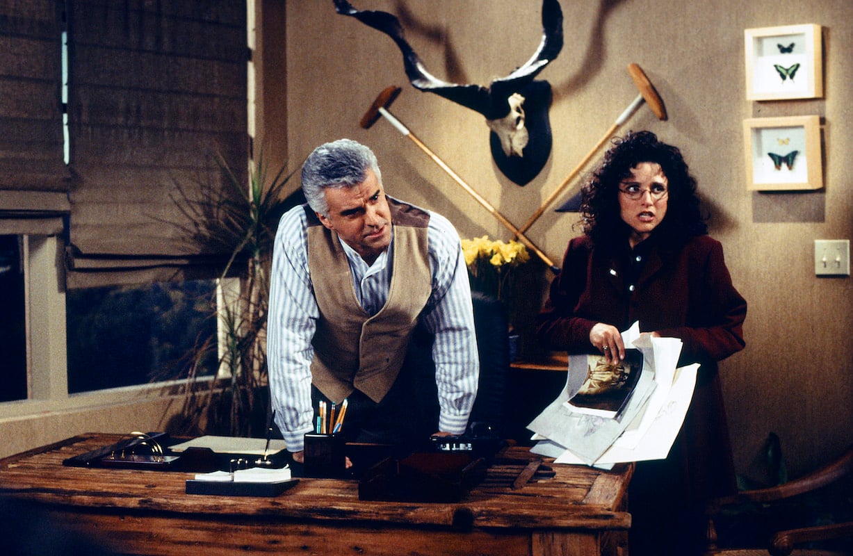 'Seinfeld' episode 'The English Patient': John O'Hurley and Julia Louis-Dreyfus lean over a desk