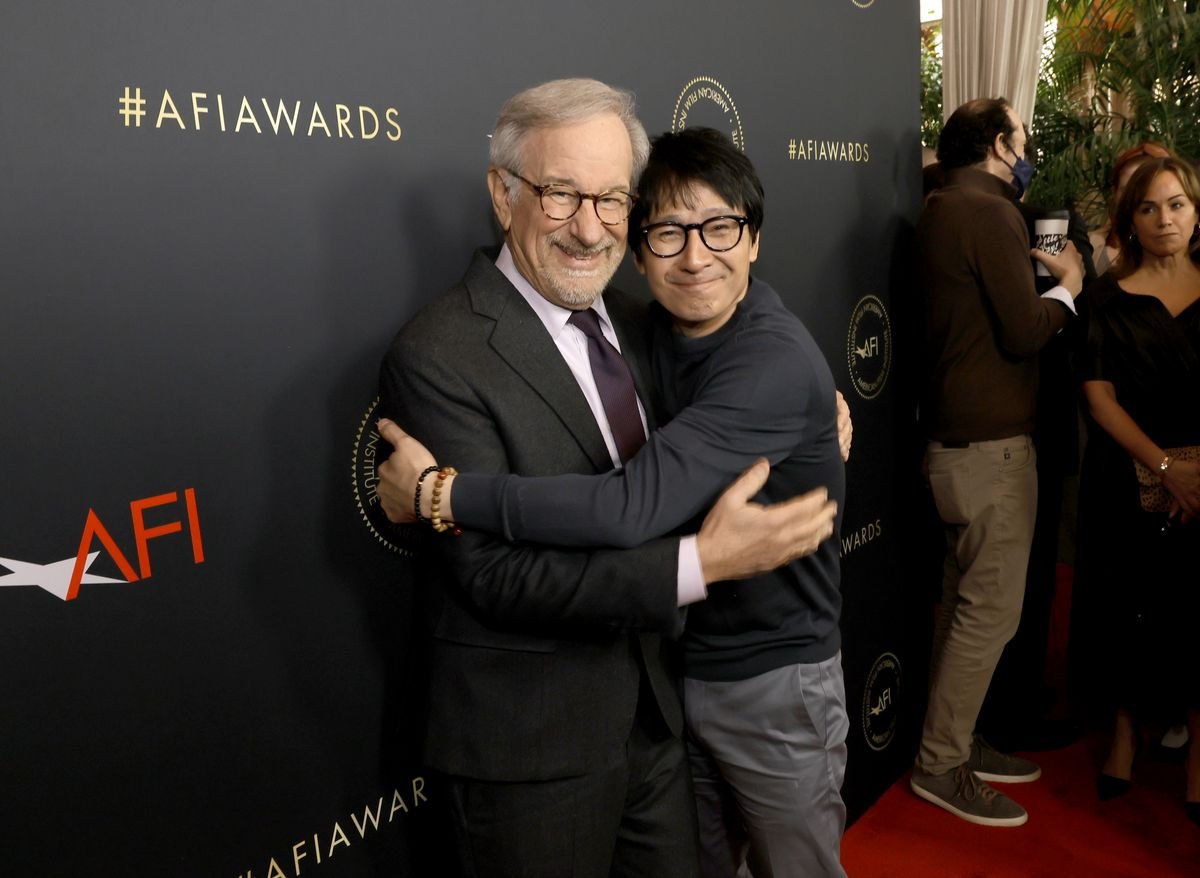 Steven Spielberg and Ke Huy Quan emberace on the red carpet for an AFI event.