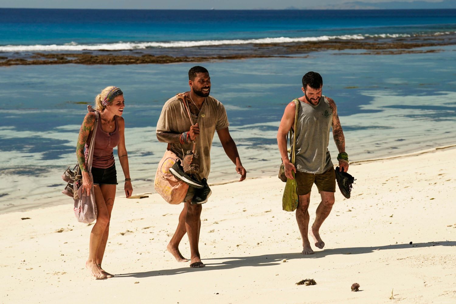 Carolyn Wiger, Brandon Cottom, and Danny Massa walk on the beach in 'Survivor 44' Episode 5 on CBS.
