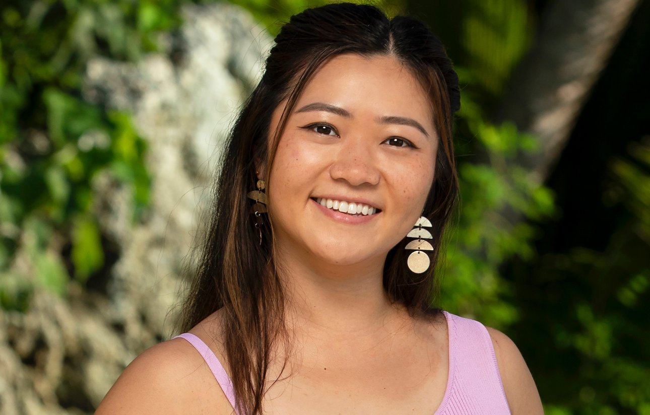 Helen Li smiles wearing a pink top on a beach for 'SURVIVOR 44'.