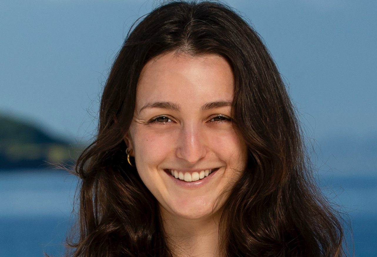 Maddy Pomilla smiles at the camera while standing on the beach for 'Survivor 44'.