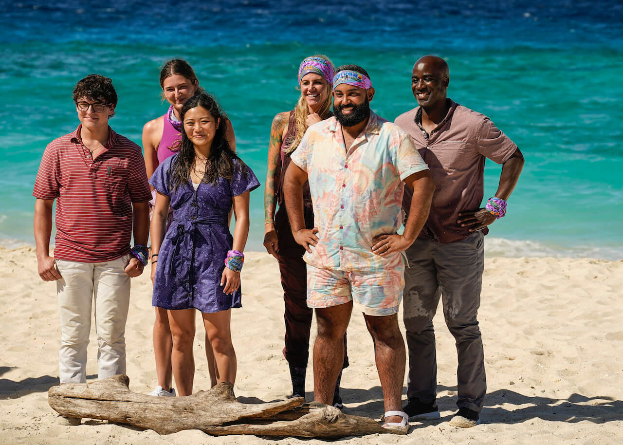 Carson Garrett, Sarah Wade, Helen Li, Yamil "Yam Yam" Arocho, and Bruce Perreault line up in front of Jeff Probst on the beach in 'Survivor 44'.
