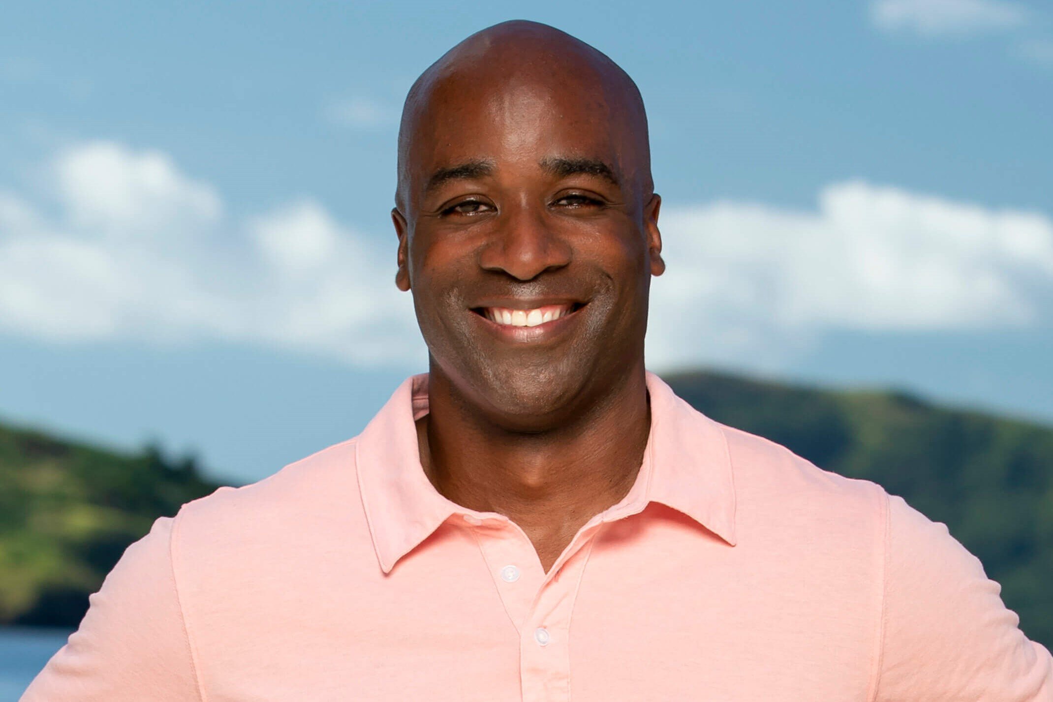 Bruce Perreault, a castaway in 'Survivor 44,' wears a light pink polo shirt.