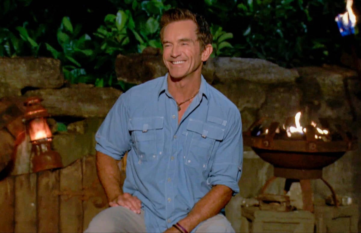 'Survivor' host and executive producer Jeff Probst smiling at tribal council