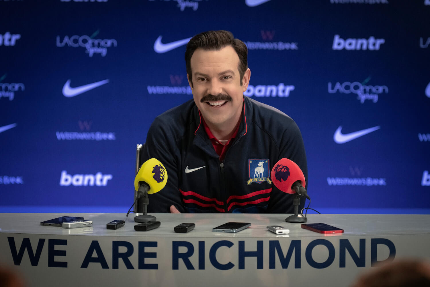 Jason Sudeikis as Ted Lasso in a production still from season 3. The 'Ted Lasso' cast recently met with President Biden for a conversation about mental health.