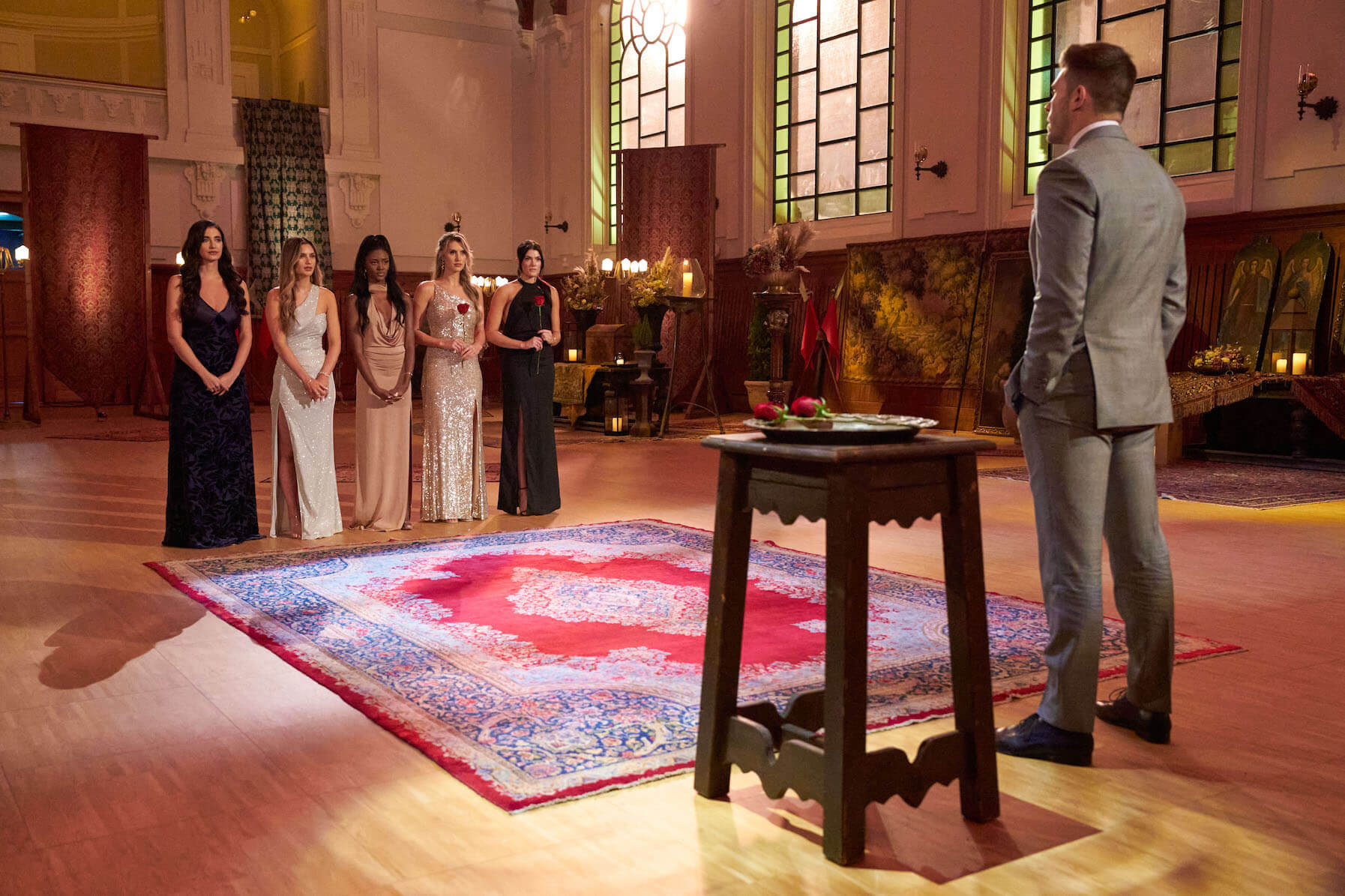 'The Bachelor' Season 27 final four cast members standing in front of Zach Shallcross before a rose ceremony