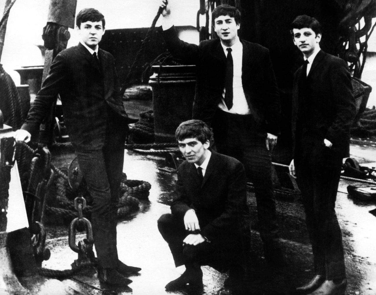 The Beatles wearing suits in around 1962.