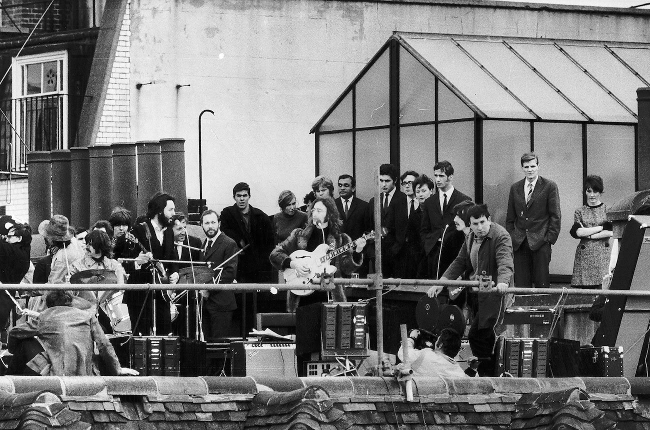 The Beatles performing during their famous rooftop concert in 1969.
