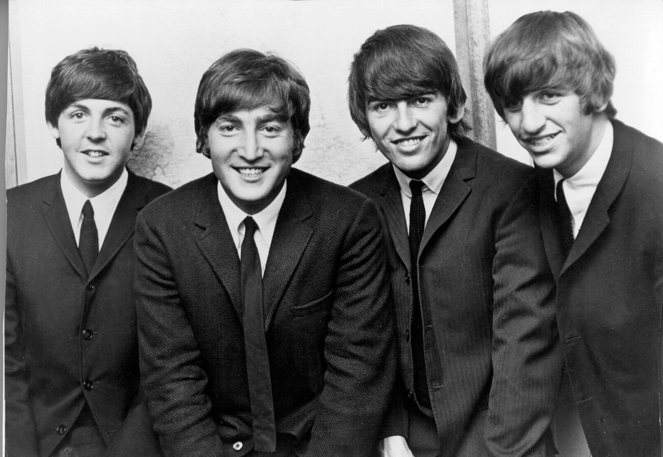 The Beatles posing in suits in the mid-1960s.