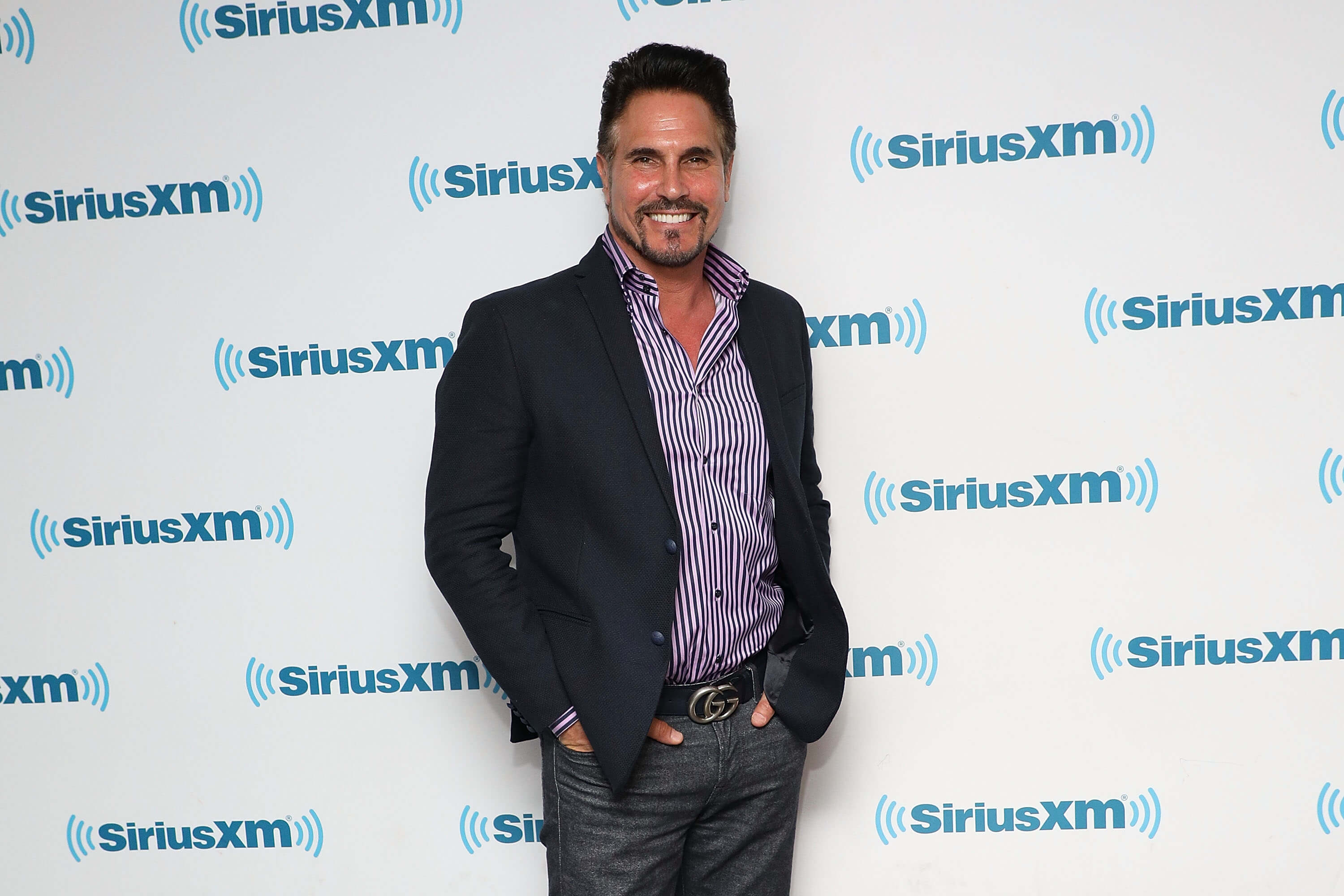 'The Bold and the Beautiful' star Don Diamont dressed in jeans, striped shirt, and jacket; poses on the red carpet.