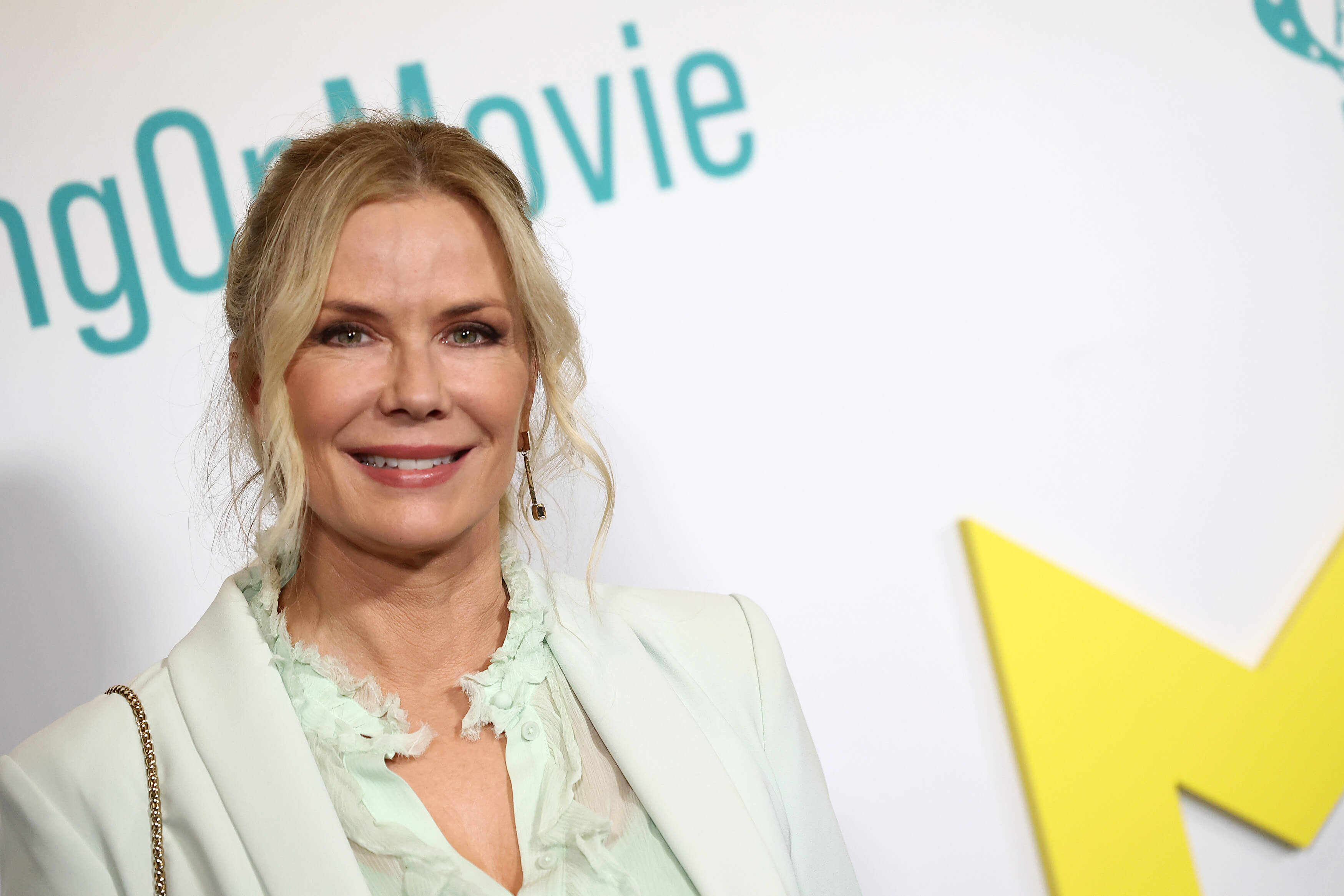 'The Bold and the Beautiful' star Katherine Kelly Lang dressed in a white pantsuit; posing on the red carpet.