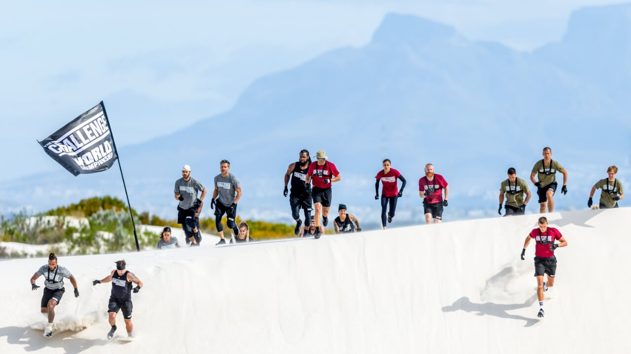 The cast of 'The Challenge: World Championship' running down a hill