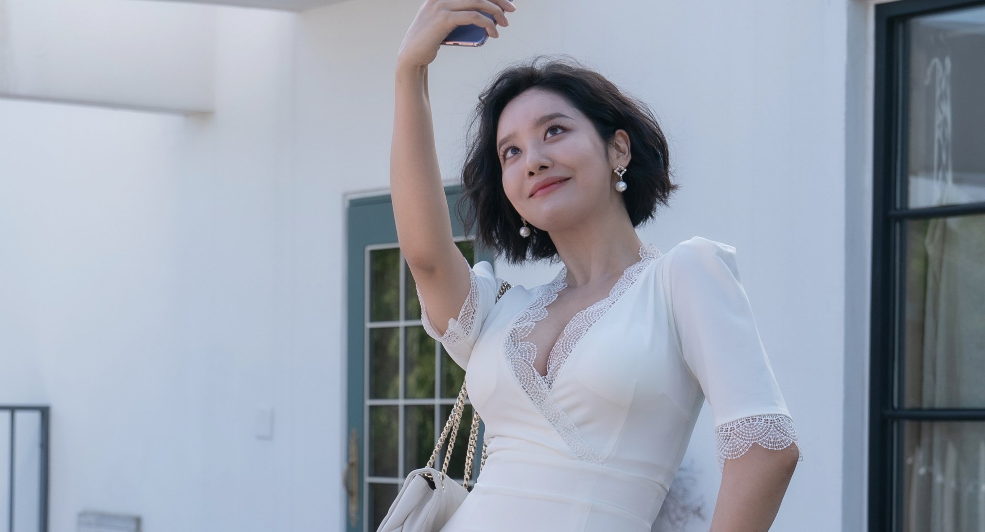 'The Glory' actor Cha Joo-young wearing a white dress.