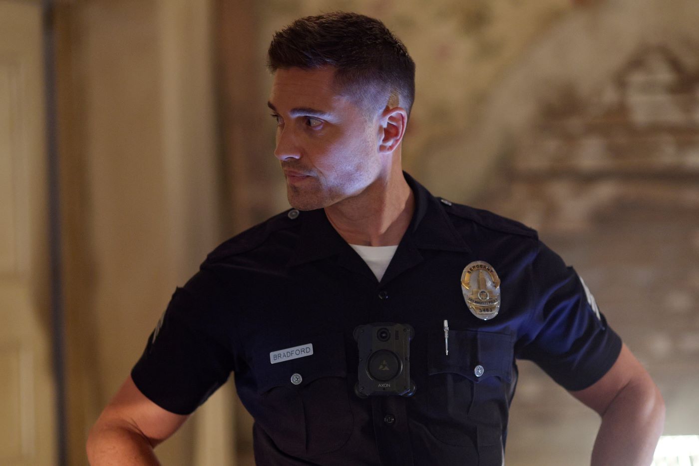 Eric Winter, in character as Tim Bradford in 'The Rookie,' which ABC has yet to renew for season 6, wears his dark blue police uniform.