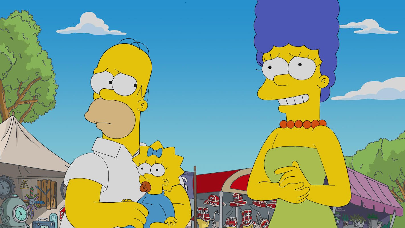 'The Simpsons': Homer holds Maggie while Marge rubs her hands
