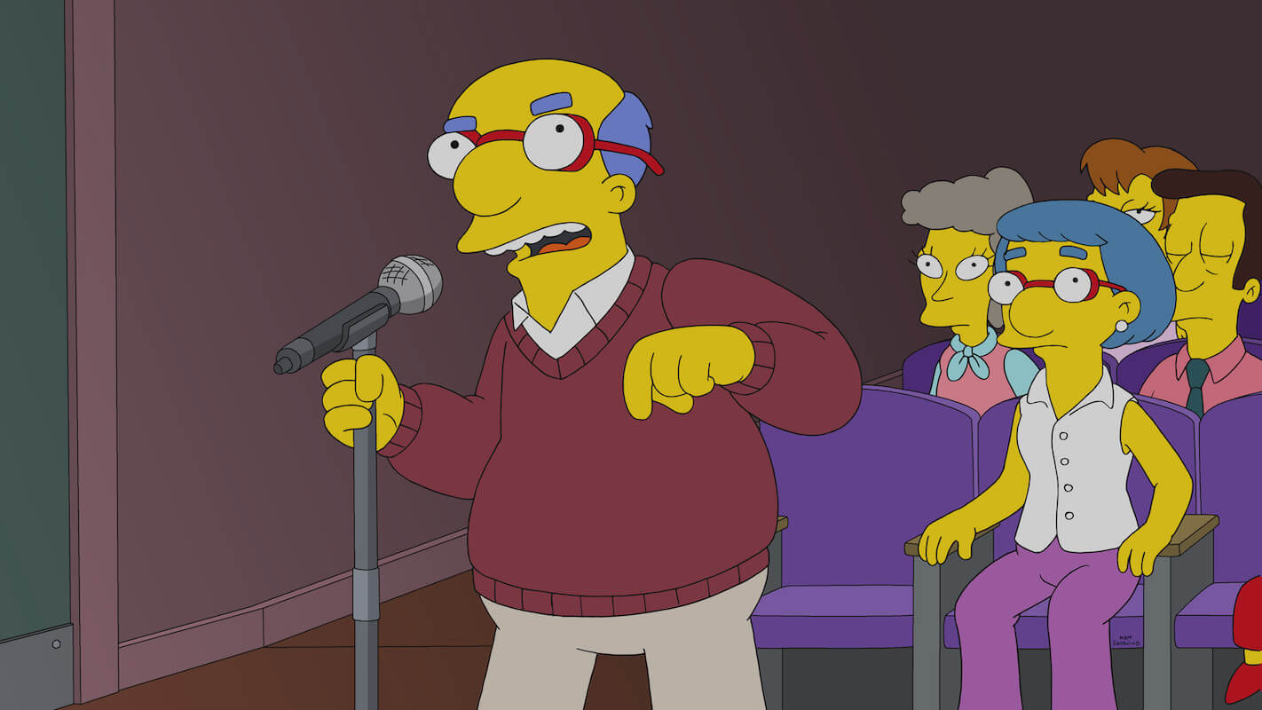 'The Simpsons': Kirk protests history lessons at a school meeting