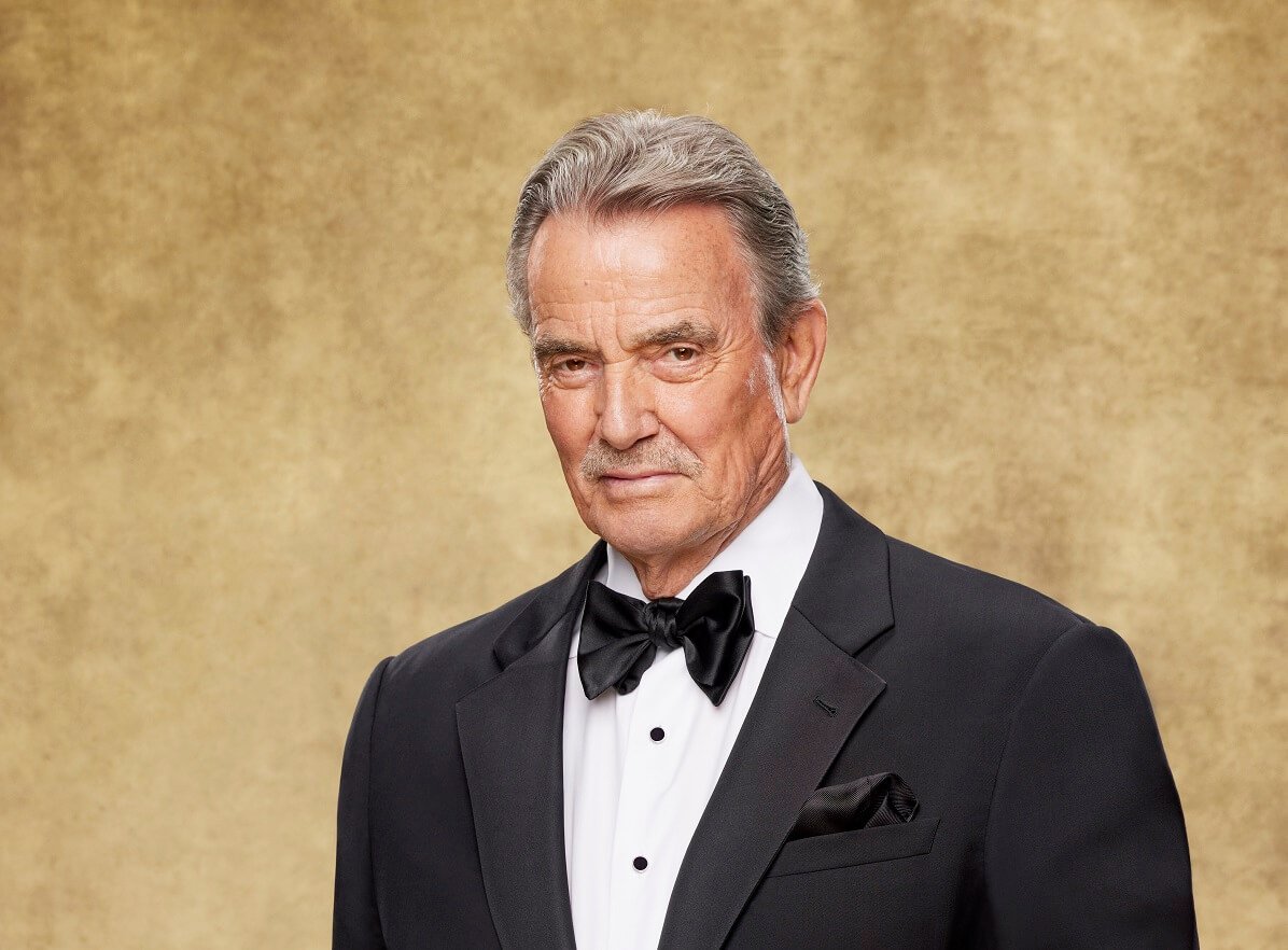 'The Young and the Restless' star Eric Braeden dressed in a tuxedo and posing in front of a gold backdrop.