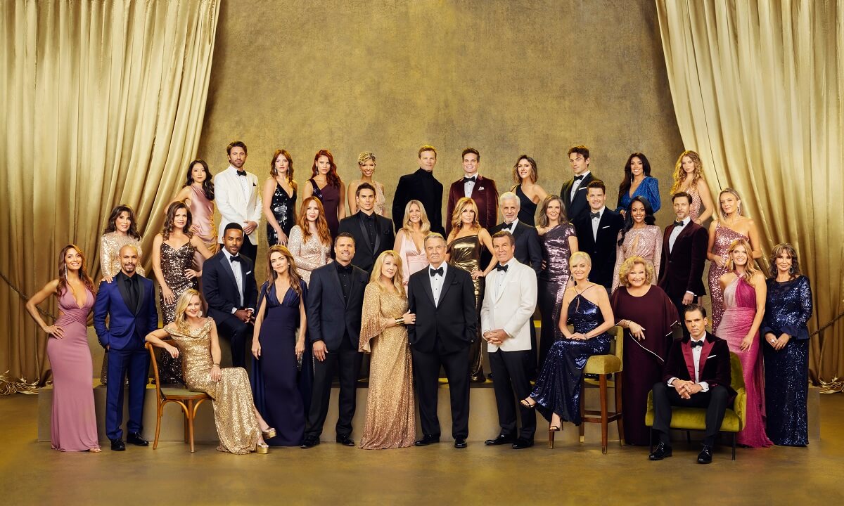 'The Young and the Restless' cast posing in front of a gold backdrop for the show's 50th anniversary photo.