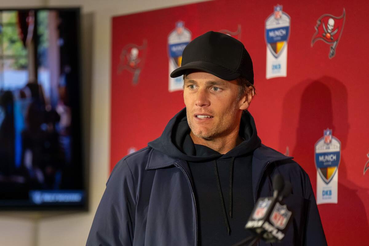 Tom Brady looks at the media after an NFL game at the end of his NFL career