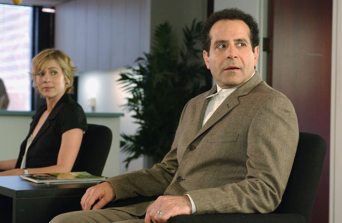 Tony Shaloub at Adrien Monk sitting in a chair in an episode of 'Monk'