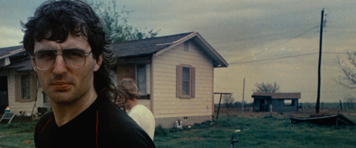 In the true crime documentary, Waco: An American Apocalypse, David Karesh stands in front of a house in Waco, TX.