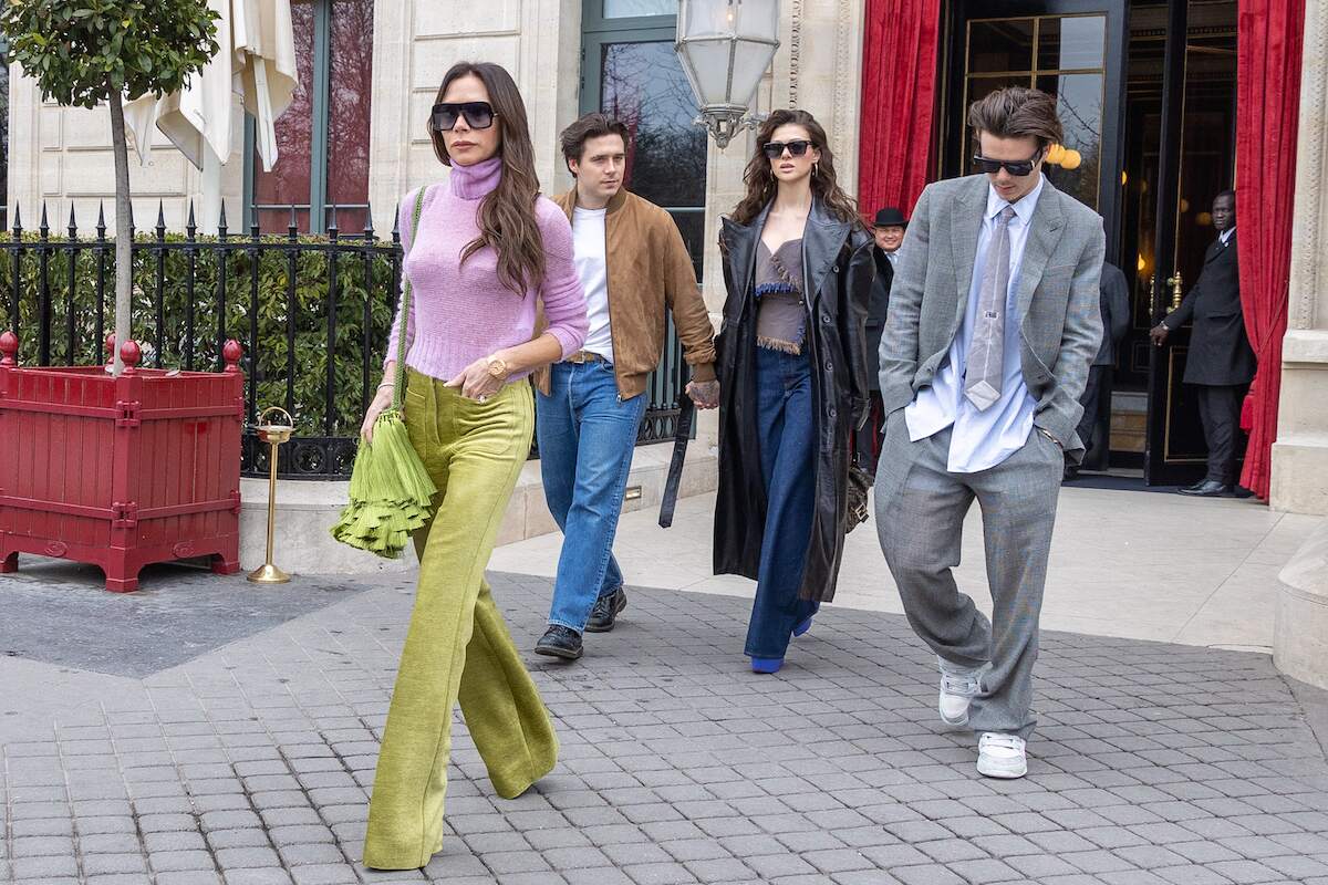 Matriarch Victoria Beckham, Brooklyn Beckham, Nicola Peltz, and Cruz Beckham walk together in Paris, France