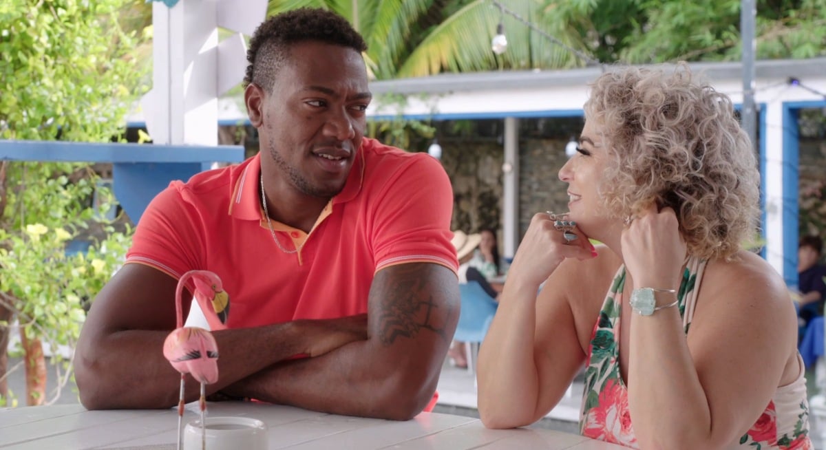 Yohan Geronimo and Daniele Gates sitting at a restaurant in the Dominican Republic on '90 Day Fiancé: The Other Way' Season 4 oon TLC.