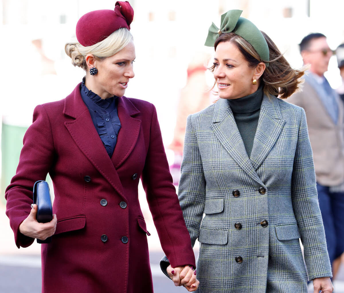 Zara Tindall, the British royal with the most 'tactile' body language, holds hands with Natalie Pinkham at the 2023 Cheltenham Festival