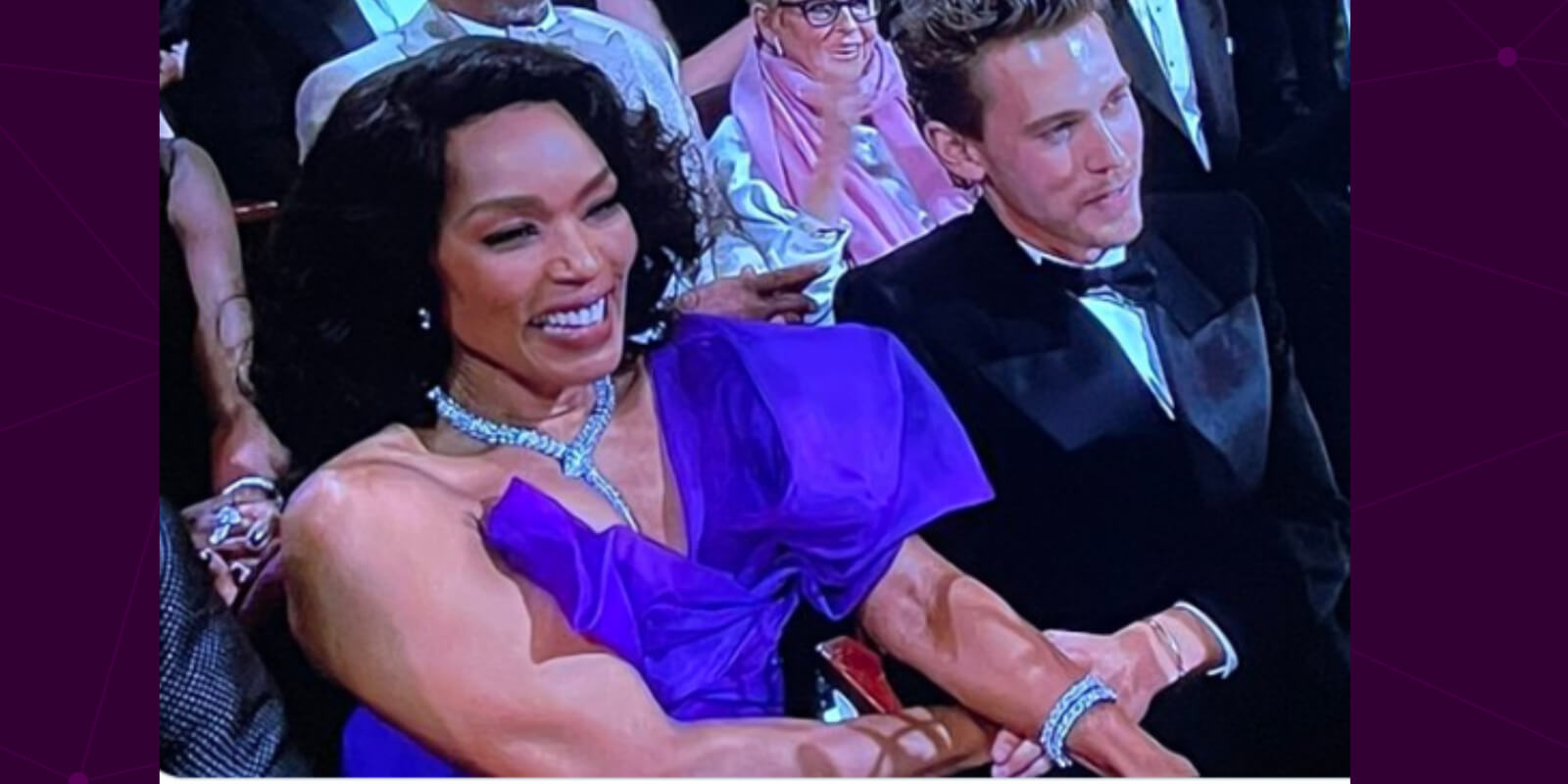 Angela Bassett holds Austin Butler's hand during Oscars 95.