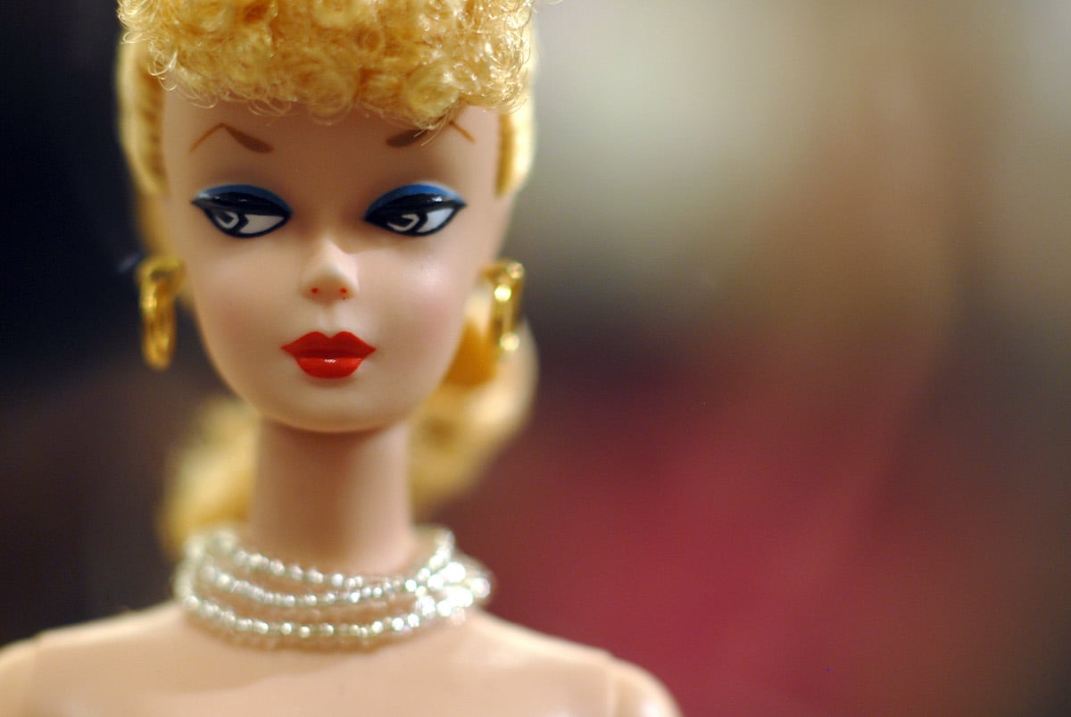 Vintage Barbie doll with bangs and pearl necklace