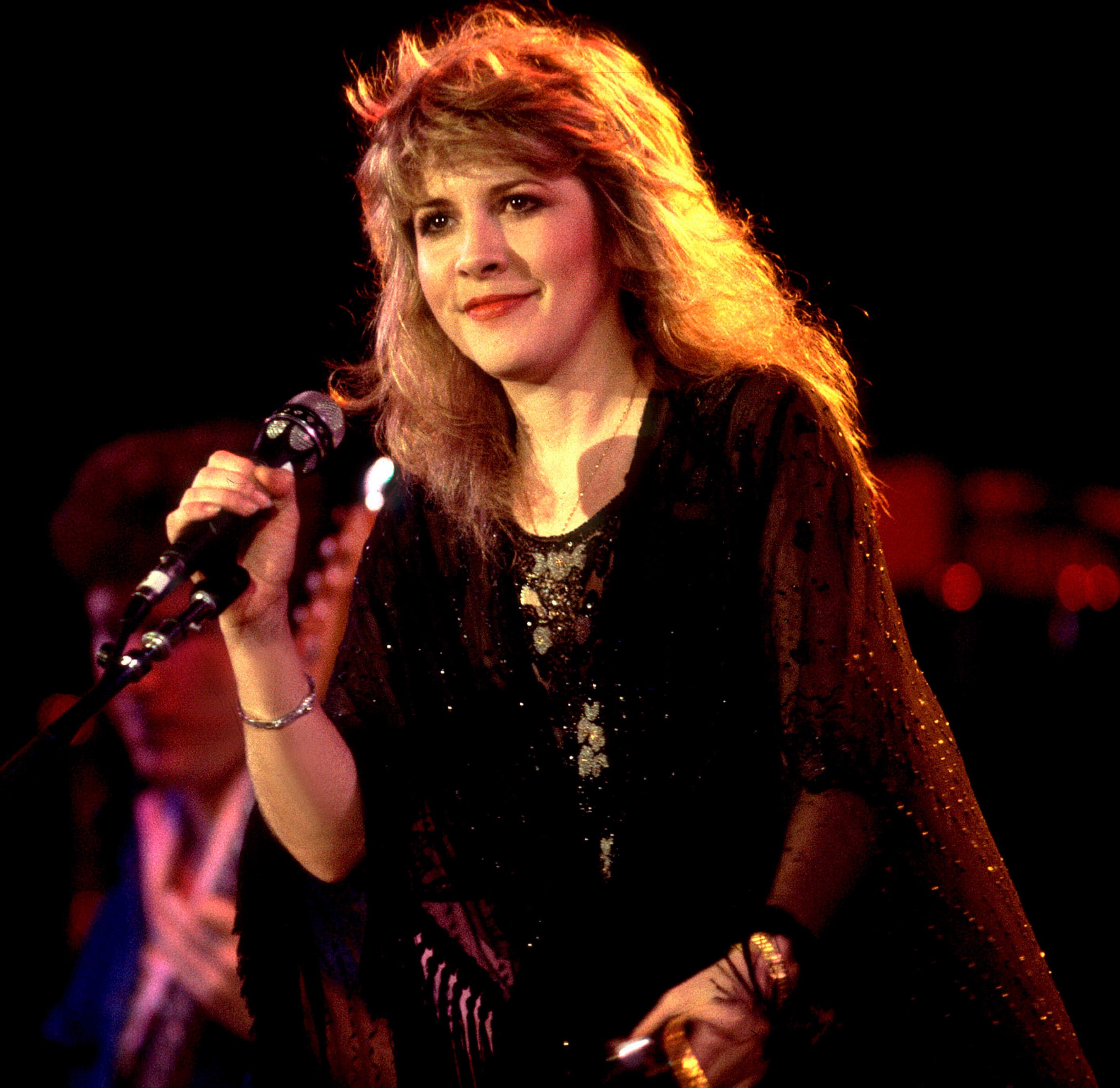 Stevie Nicks with a microphone