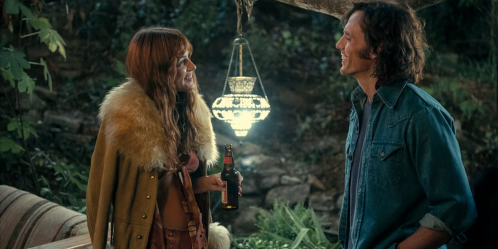Riley Keough wears a coat made by Elvis Presley's designer in the film 'Daisy Jones & The Six' with Sam Claflin.