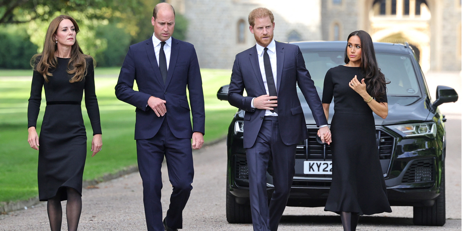 Kate Middleton, Prince WIlliam, Prince Harry and Meghan Markle meet well-wishers after Queen Elizabeth's death in Sept. 2023.