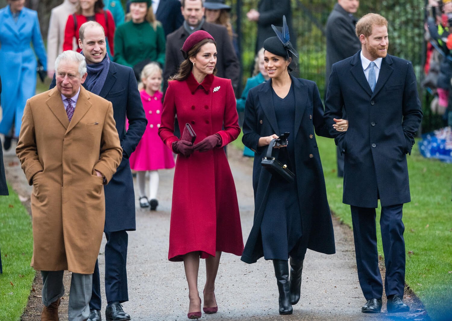 King Charles wears a brown coast while walking with Prince William, Kate Middleton and Meghan Markle walk and talk, and Prince Harry