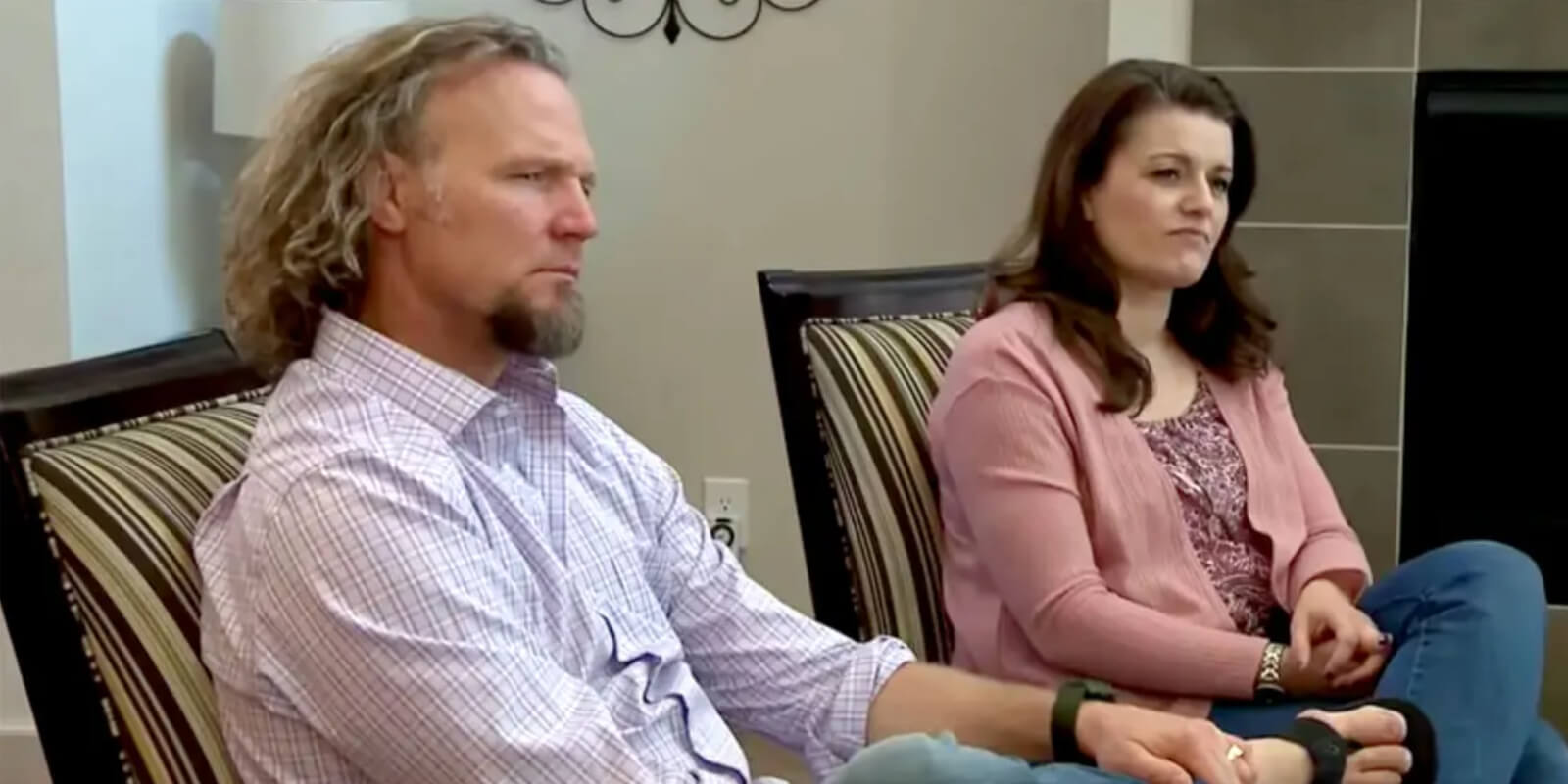 Kody and Robyn Brown are seated together in a scene from TLC's 'Sister Wives.'